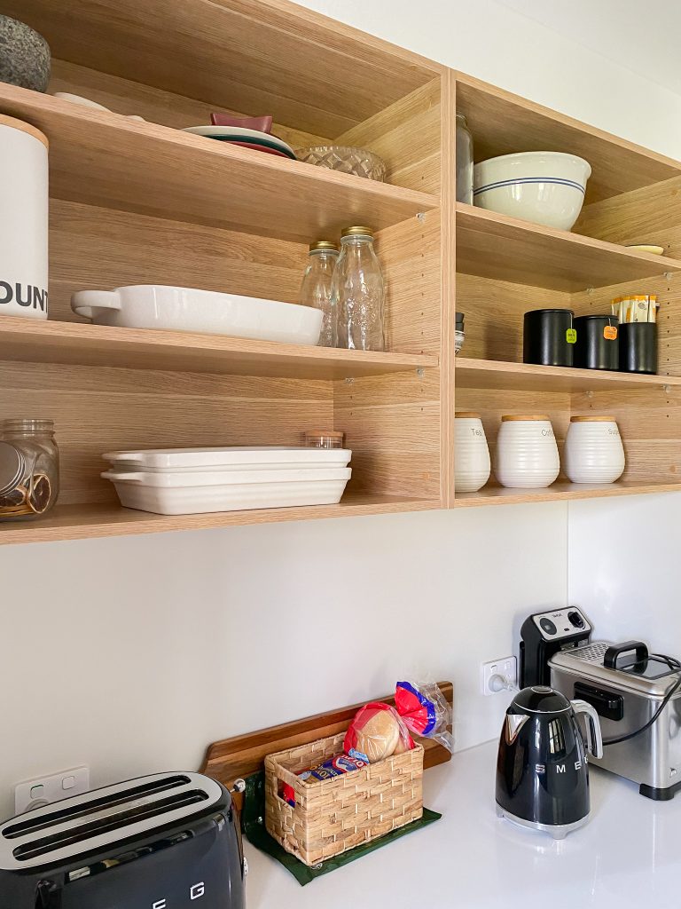 Open shelving in a butler's pantry filled with high use items