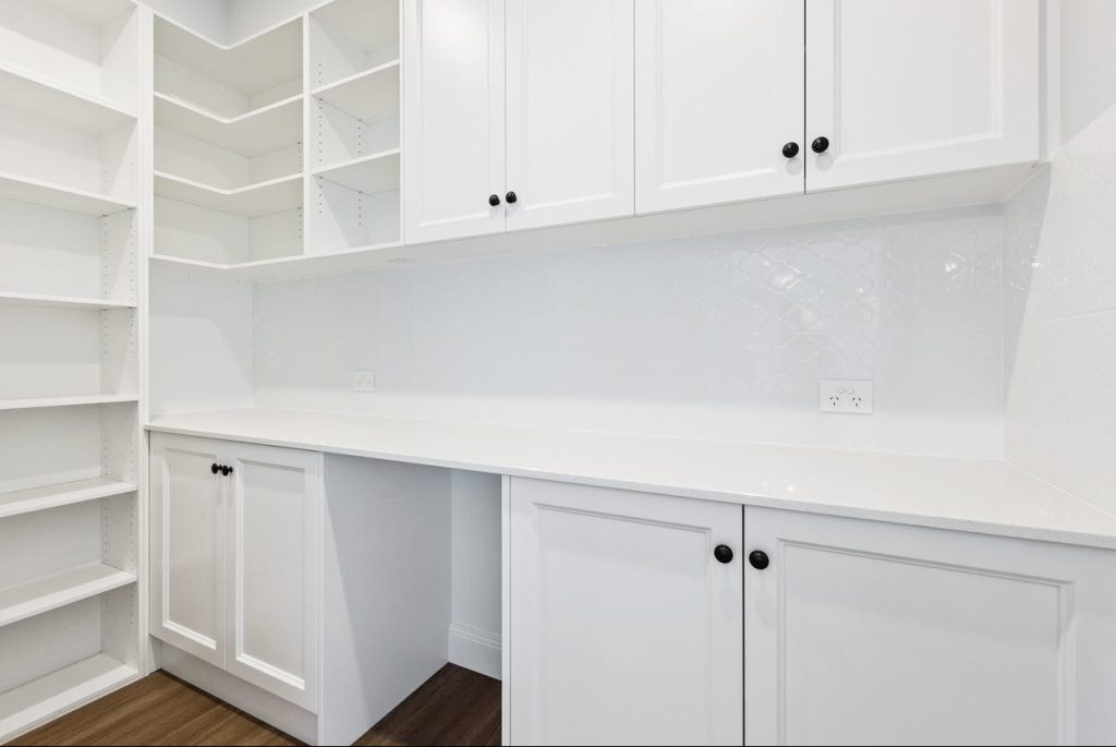 Useful butler's pantry cabinetry space for kitchen items, food items and taller items