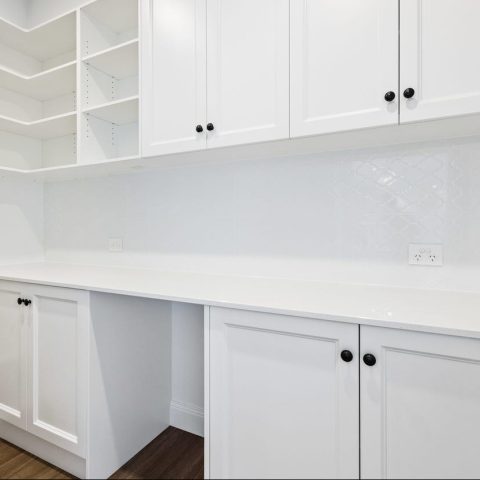 Useful butler's pantry cabinetry space for kitchen items, food items and taller items