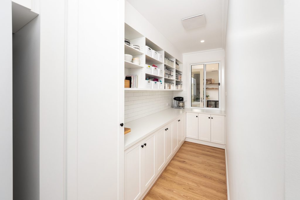 Pantry with window to allow natural light and ventilation into the space