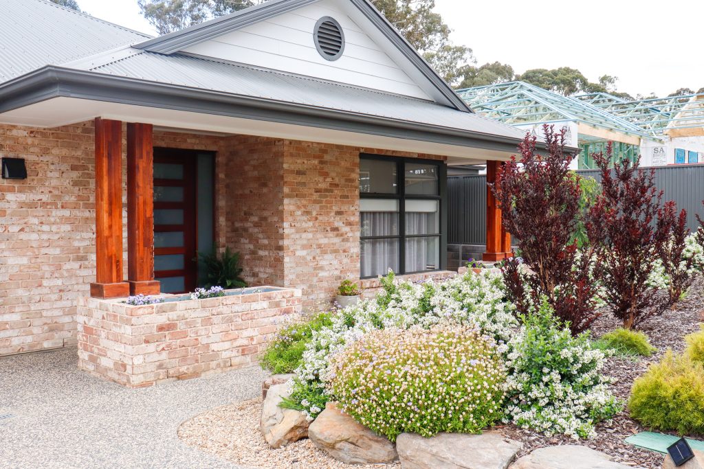 House in Mount Barker: Roof, Fascia, Barge and Gutters – Woodland Grey®, Gable – cladding, Walls – bricks, Piers – bricks and timber