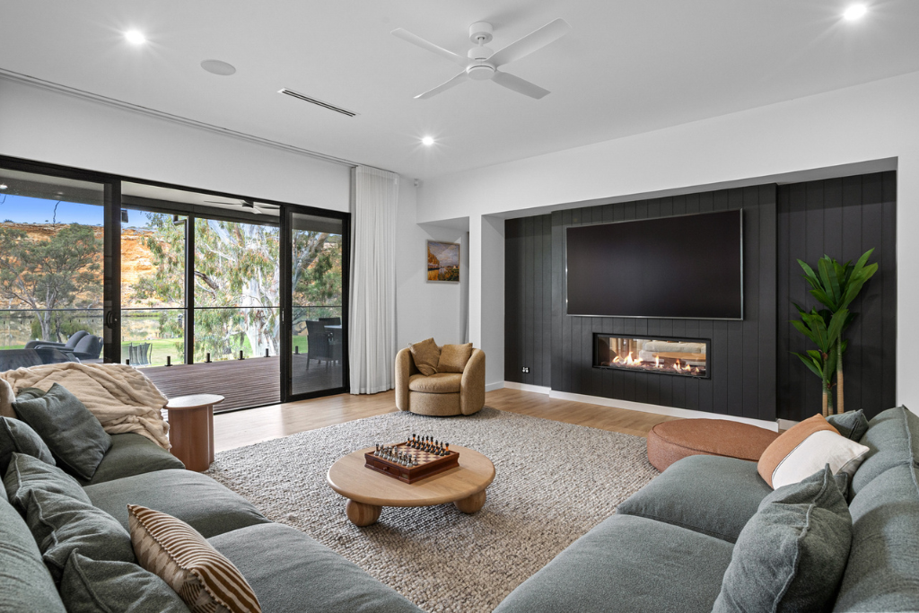 Warming the space in your new home with rugs and sheer curtains
